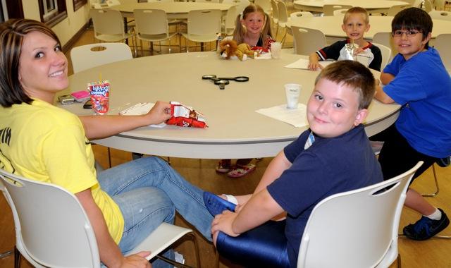 The Mad Scientist class is always a top favorite for kids who love science and inventing. Instructor Laura Hall, a CU senior majoring in Education, at right, is pictured here with her mad scientists, going left around the table: Conlan Beck, William Chaplin, Cyrus Vincent and Delilah Talbott. More photos of Albany Kids College appear at the bottom of the story. (CU Photo by Linda Waggener)